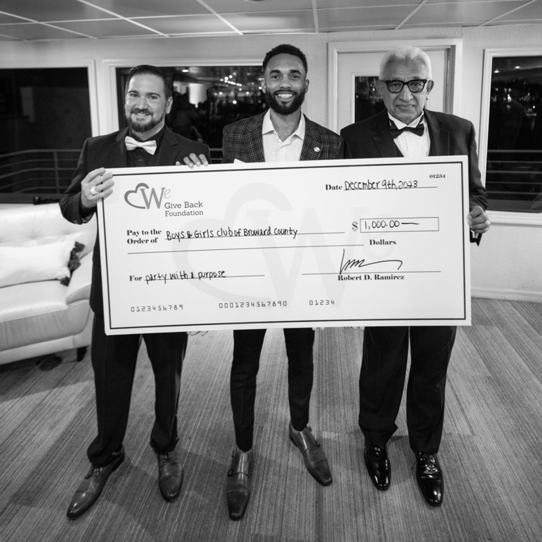 Kenneth Barr - Robert D. Ramirez Check presentation Boys and Girls Club