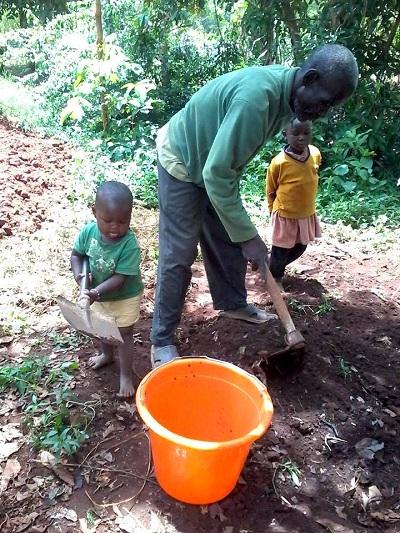 father farming with children