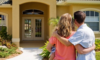 couple admiring house