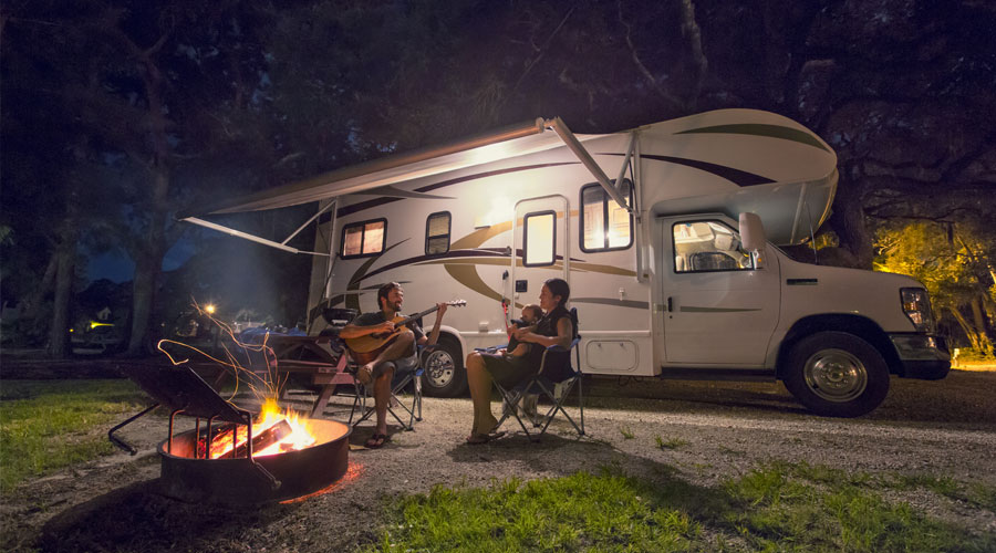 Camper Van Summer Trip. Scenic Landscape and the Recreational Vehicle.