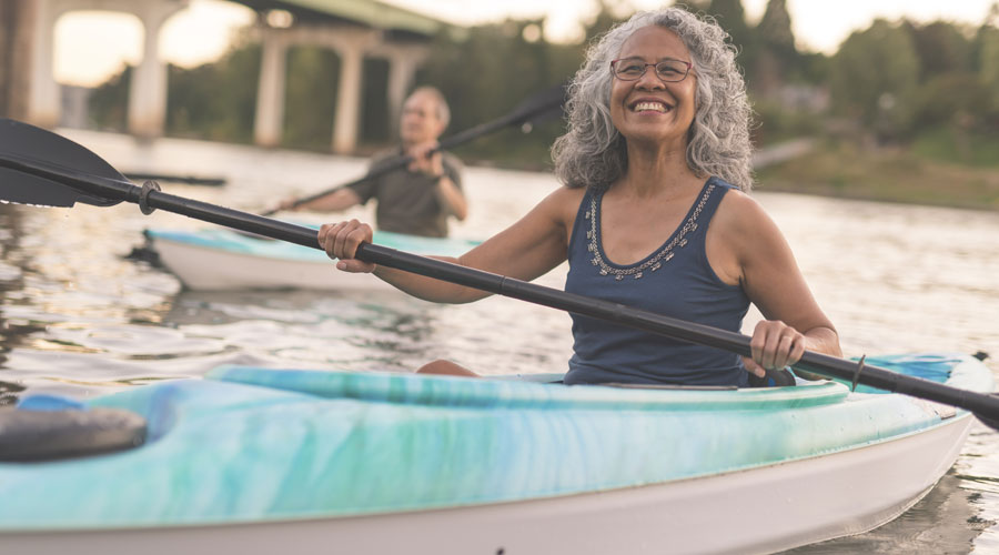 woman kayaking 900x500