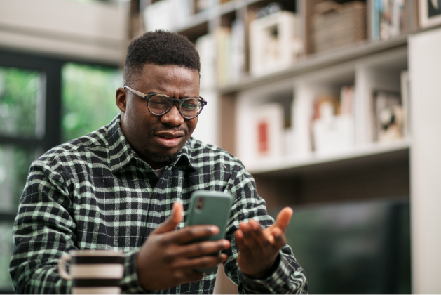 person concerned on phone with Mobile Payment App Scams